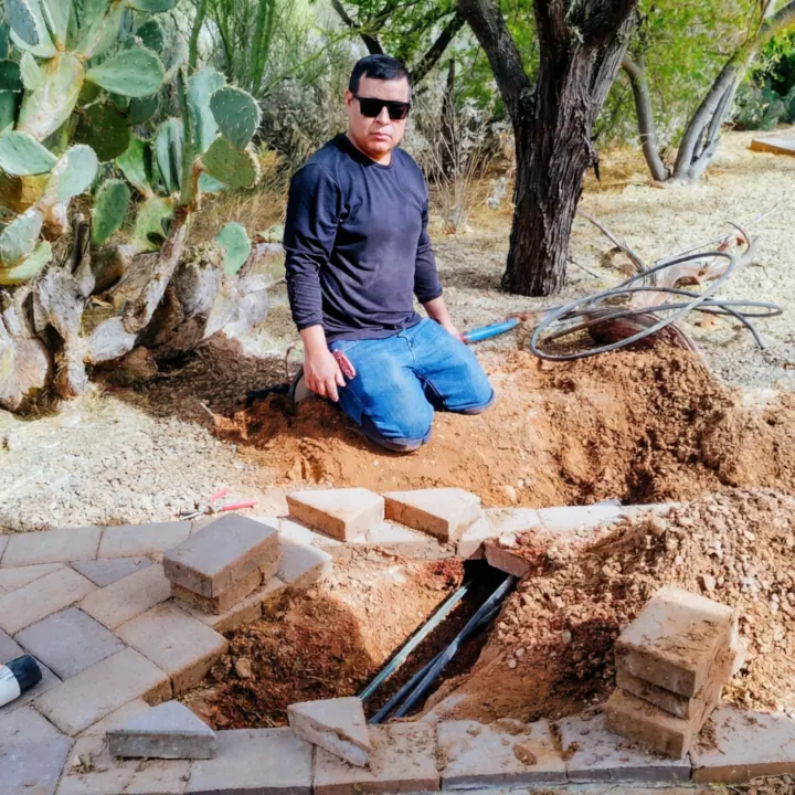Unico Irrigation team installing sprinkler system